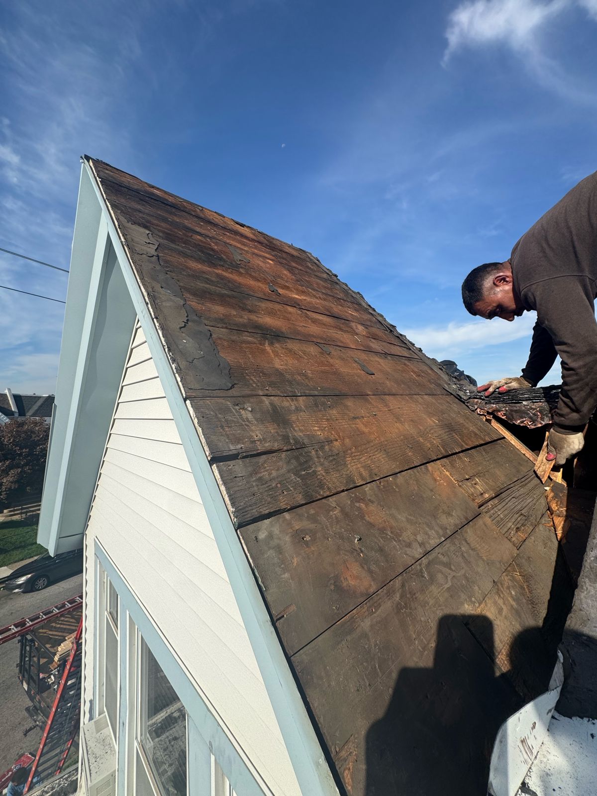 Steep-slope roof: before, stripped to the deck